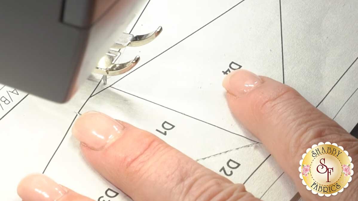 A piece of foundation paper piecing being sewn