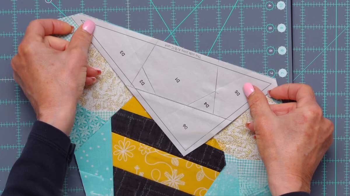 fpp_august_4_matching_pieces.jpg Two foundation pieced sections brought together, with all the printed angles lining up precisely before sewing.