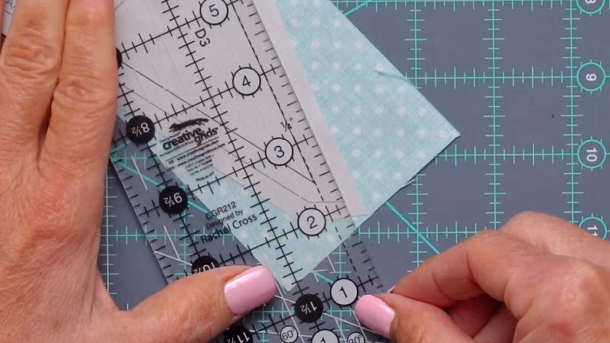 fpp_august_4_on_the_lines.jpg A ruler positioned so its dashed line sits directly over the printed solid line on the foundation, confirming correct alignment.