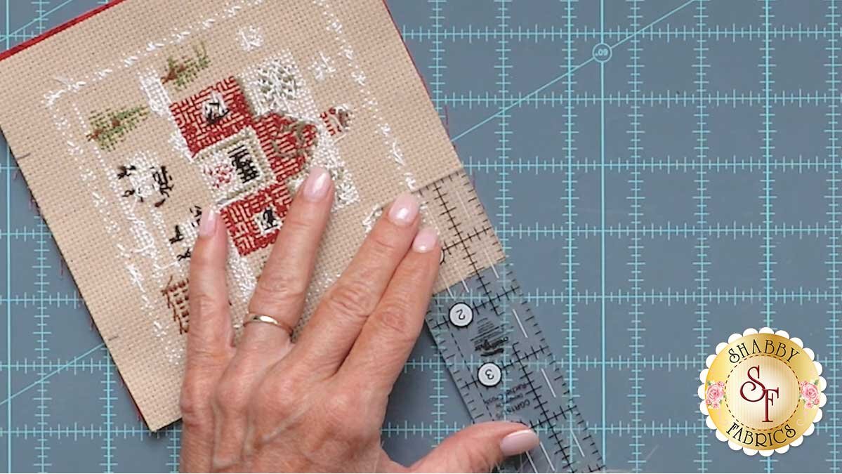 farmhouse_christmas_ornaments_measuring_for_opening.jpg A friction pen marking the start and stop points for the opening, measured in from each top corner of the ornament.