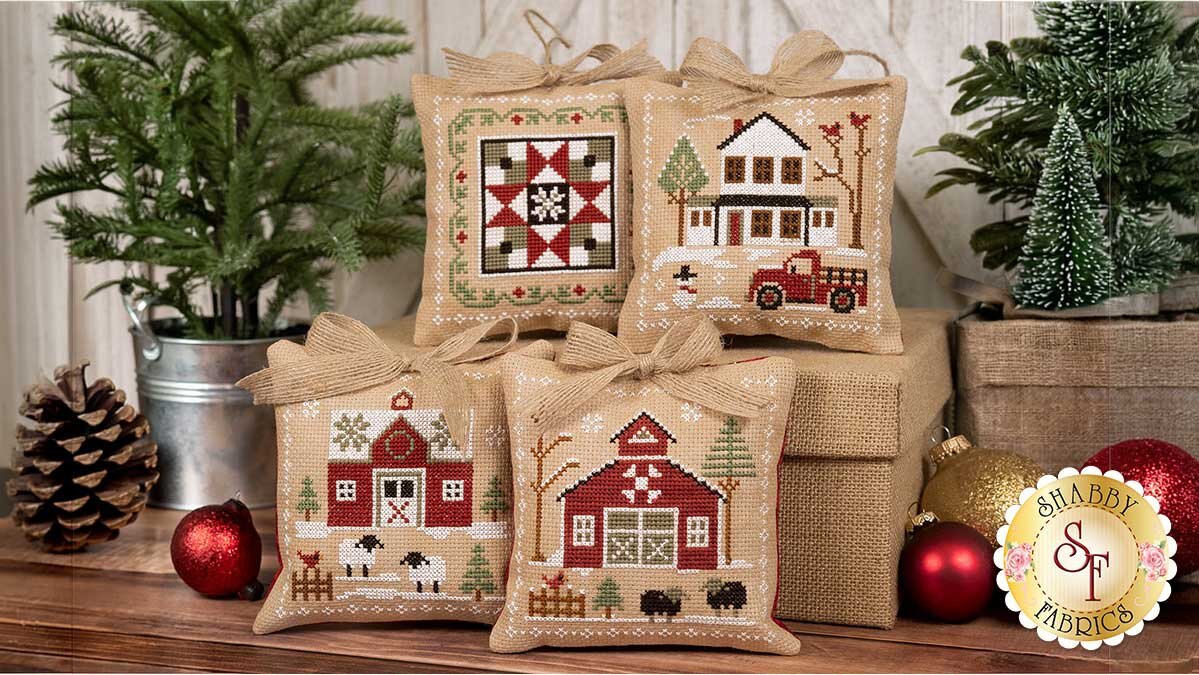 farmhouse_christmas_ornaments_pro_vingette.jpg The finished Farmhouse Christmas cross stitch ornaments, stuffed and trimmed with jute hangers and coordinating bows.