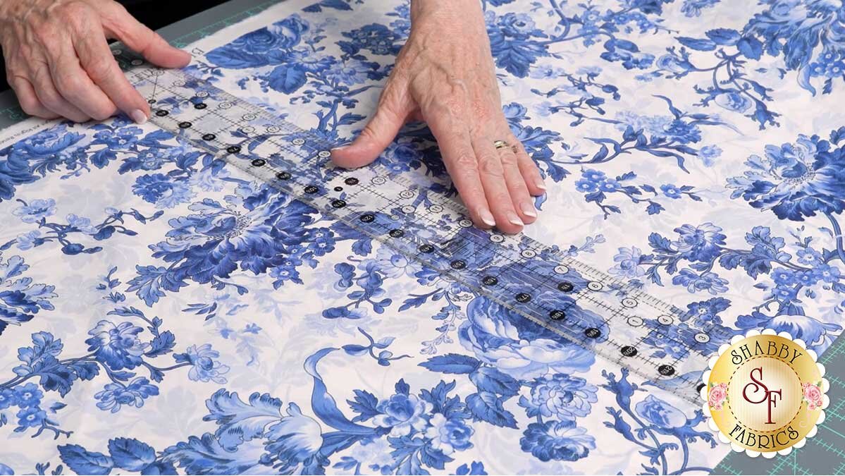 keyboard_kaleidoscope_bom_measuring_cut.jpg Fabric folded on the cut line and shifted over so the printed repeat lines up almost identically with the next one.